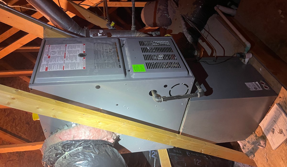 Furnace and ductwork installed in an attic mechanical room