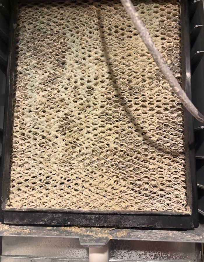 Heavily soiled evaporative cooler pad before cleaning