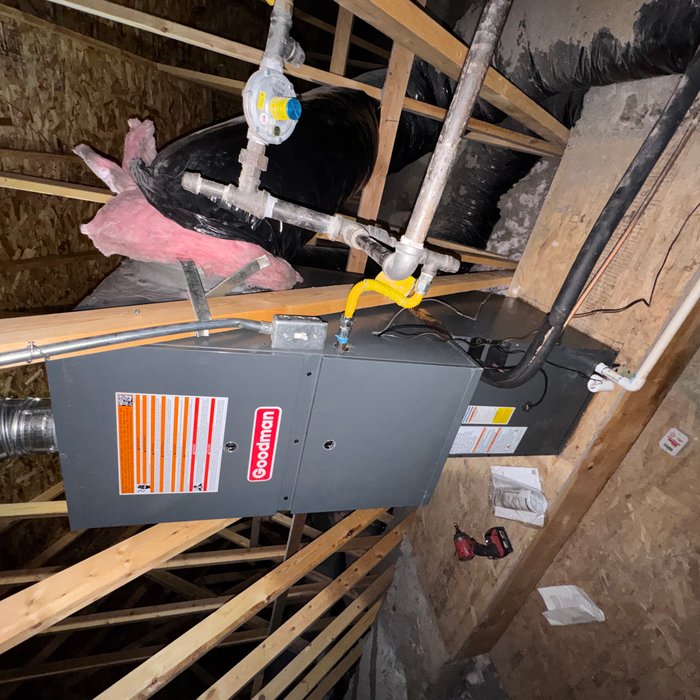 Goodman furnace installed in a home attic mechanical space