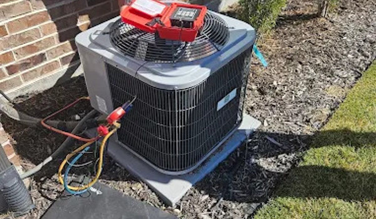 Technician testing a newly installed air conditioning system
